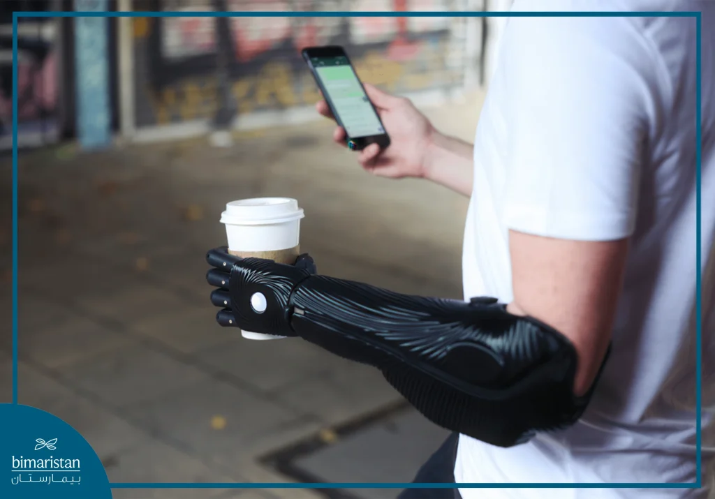 Electronic Prosthetic Limbs: Revolutionizing Motion And Muscle Control 2 A High-Tech Electronic Prosthetic Limb Holding A Cup Of Coffee And A Smartphone